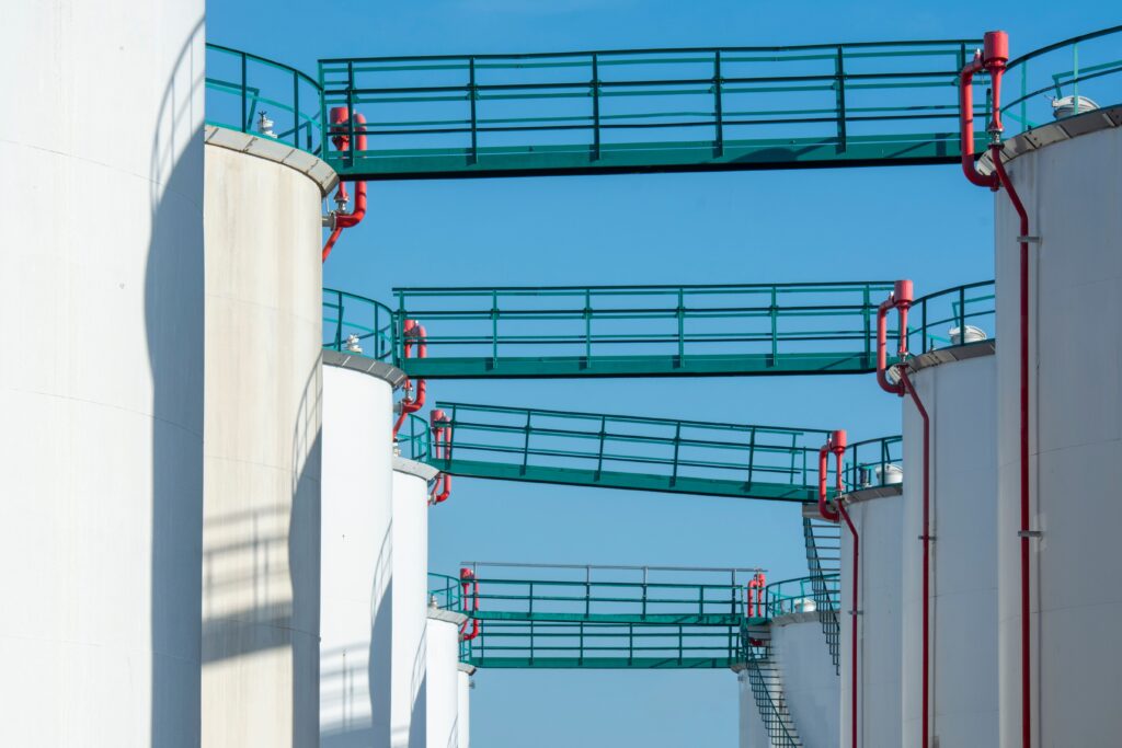 Chemical storage tanks with connecting bridges.